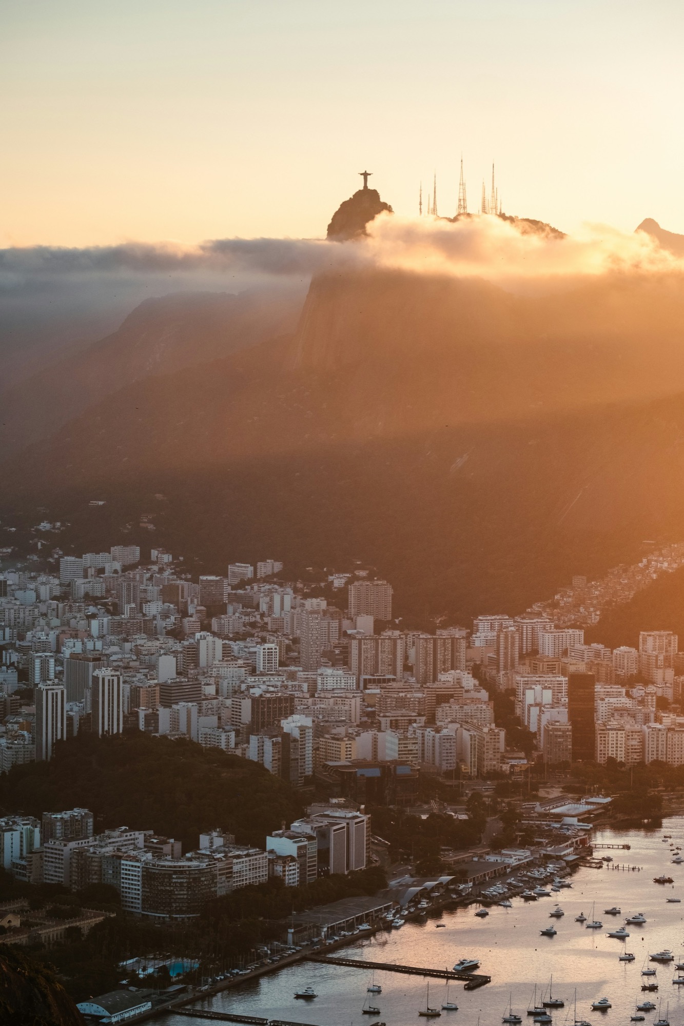 Botafogo apartment blocks under Corcovado, Christ the Redeemer above a golden mist