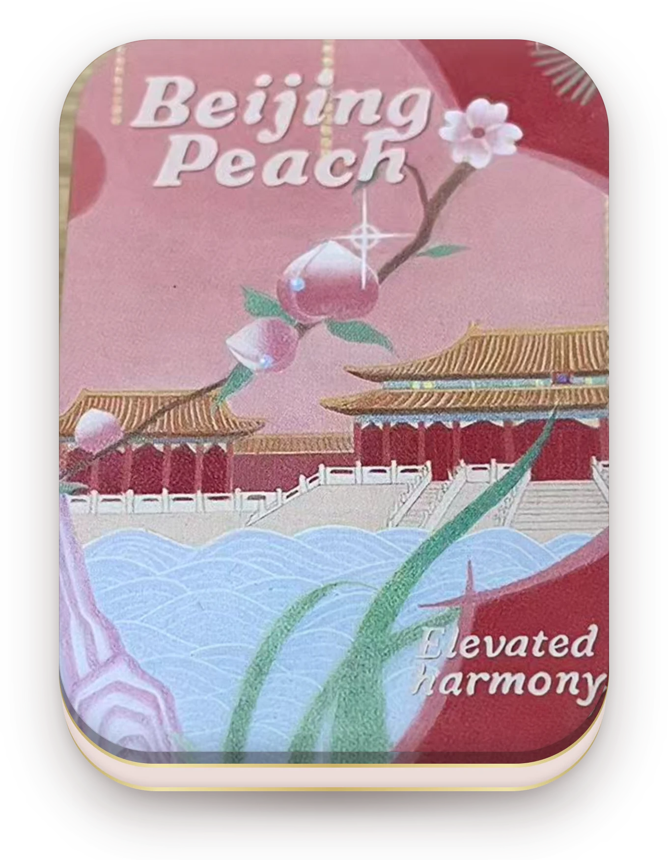 Beijing Peach tin — a pink and red lid with peach blossom over the roofs of the Forbidden City